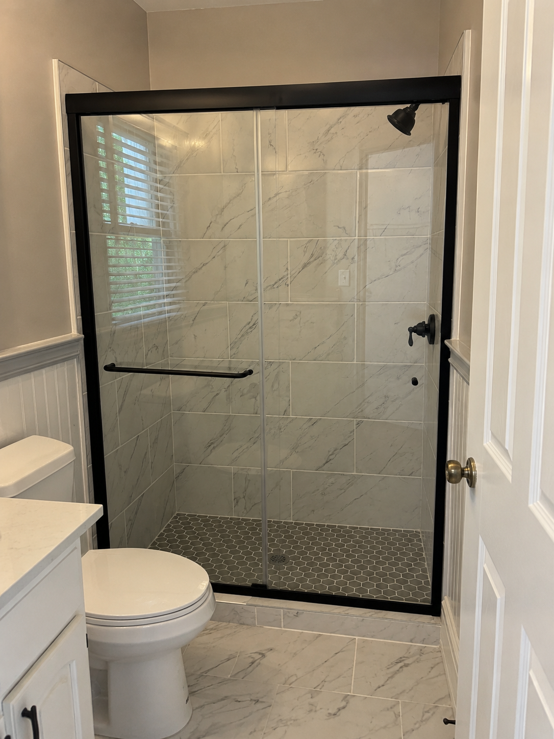 Semi-frameless sliding shower door installation